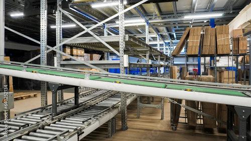 Conveyor belt in warehouse © olegosp