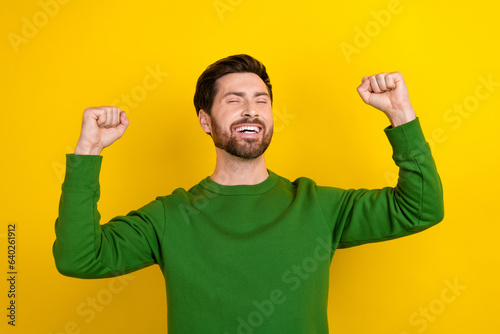 Photo of handsome successful winner businessman lucky achievement victory finally his job done isolated on yellow color background