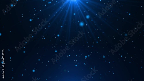 Beautiful blue dust particles with flare on black background