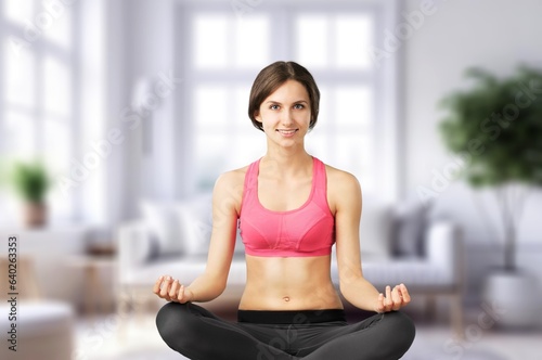 Young woman meditating in yoga pose