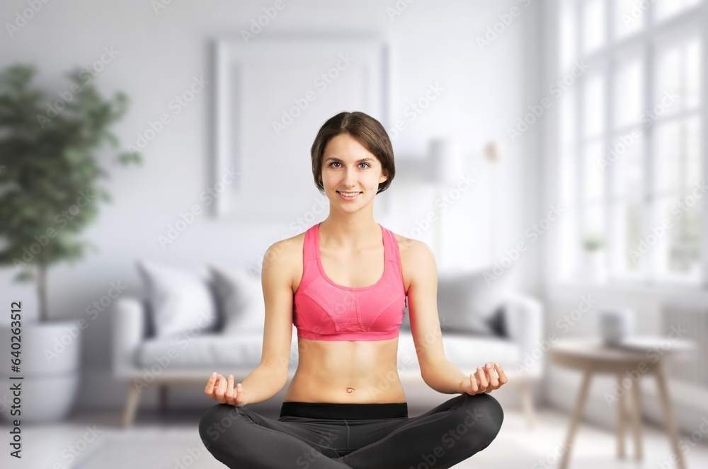 Young woman meditating in yoga pose