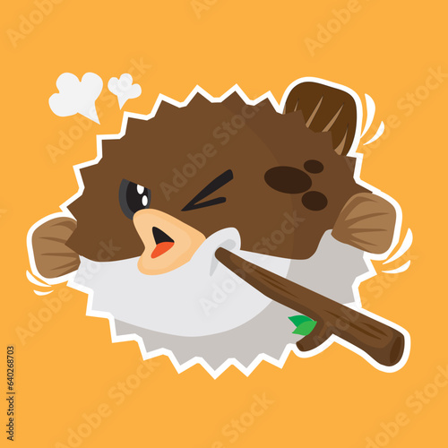 A cute puffer fish been poked by a wooden stick