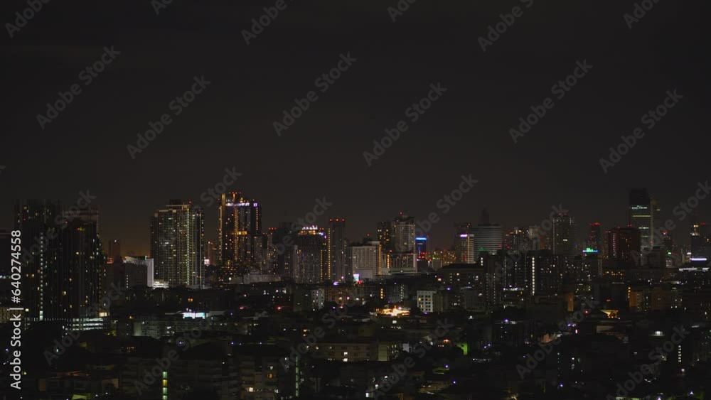 Aerial view of Bangkok metropolis cityscape night scene with light on buildings , condominium apartment hotel office building skyline Aerial view of Bangkok metropolis cityscape night scene with light on buildings , condominium apartment hotel office building skyline