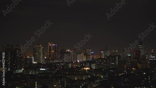 Aerial view of Bangkok metropolis cityscape night scene with light on buildings , condominium apartment hotel office building skyline