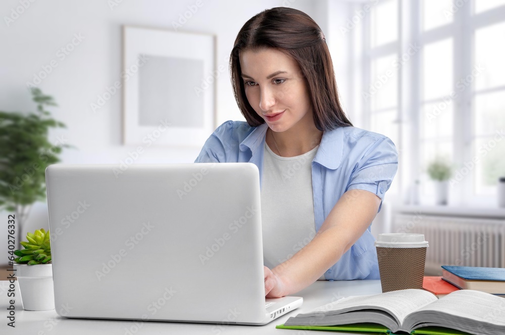 Young professional happy business woman working on laptop Young professional happy business woman working on laptop