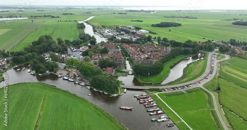 Aerial drone view of the smallest city in Friesland, SLoten. Sloten is connected to the Slotermeer via the Slotergat and is located between Lemmer and Balk. photo