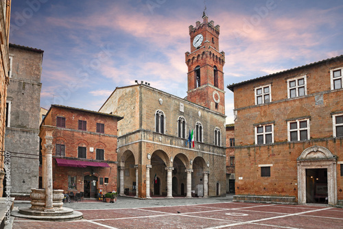 Pienza, Siena, Tuscany, Italy: the main square with the ancient city hall and the water well