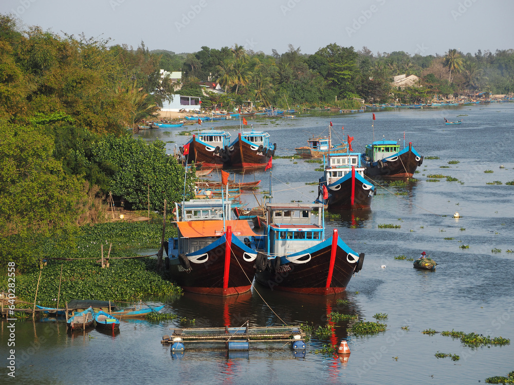 Fishing boats moored by the river in Tam Ky, Quang Nam, Vietnam