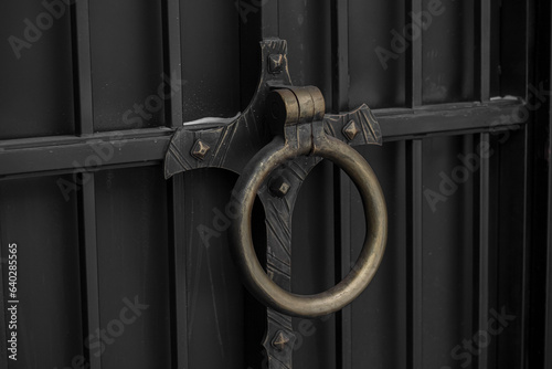 Metal round handle on large gate