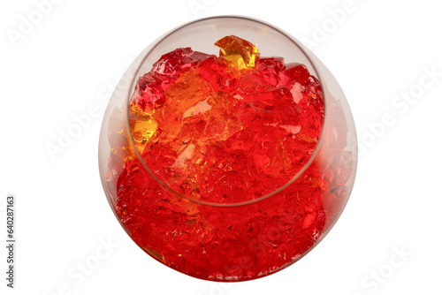 Sweet fruit jelly dessert in a glass isolated on a white background.