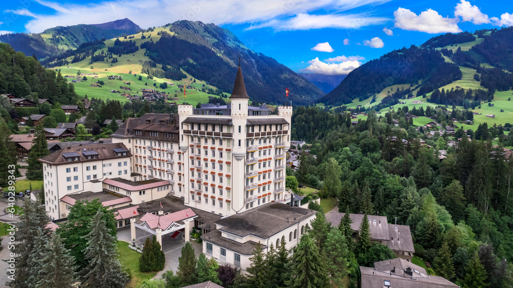 Gstaad - elegant and popular mountain ski resort in Swizerland, canton Bern. aerial drone panoramic view
