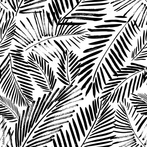 Brush drawn palm leaves seamless pattern. Abstract tropical foliage background. Grunge tropical leaves texture. Foliage ornament with exotic branches. Vector natural seamless pattern.