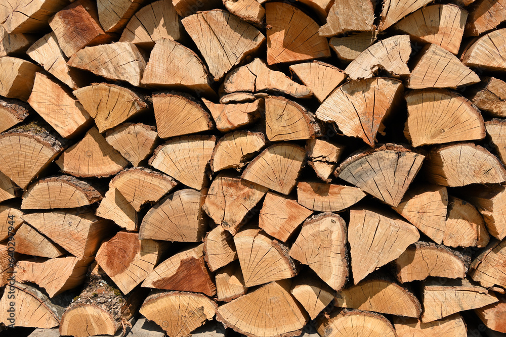 stacked wood logs, firewood prepared for winter heating stacked wood logs, firewood prepared for winter heating