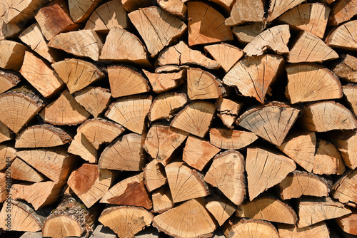 stacked wood logs, firewood prepared for winter heating