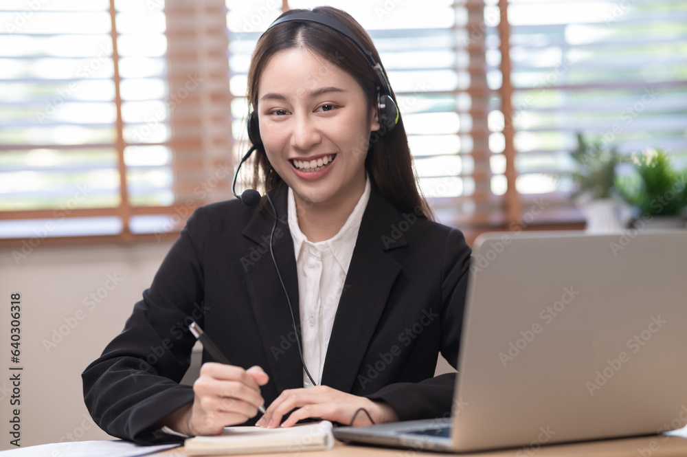 Portrait photo of Asian woman using video call communicate with business colleague friend or making an online job interview from home . Asian woman in formal business suit looking at camera. Portrait photo of Asian woman using video call communicate with business colleague friend or making an online job interview from home . Asian woman in formal business suit looking at camera.
