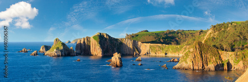 Evening Atlantic ocean coastline landscape. Beautiful Gueirua beach with rock formations, Asturias, Spain.