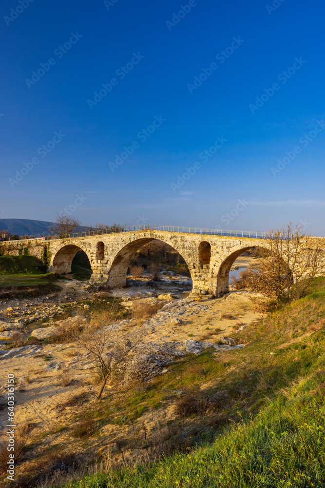 Pont Julien, roman stone arch bridge over Calavon river, Provence, France