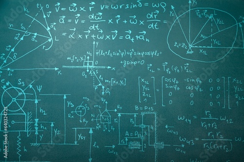 Operations and formulas handwritten on chalk blackboard