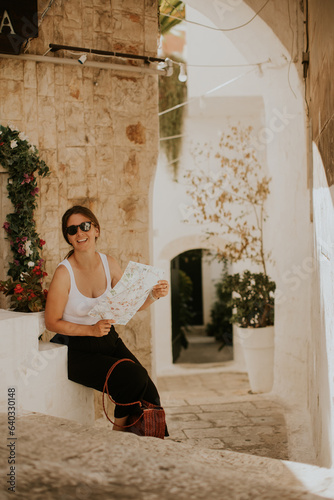 Female tourist with paper c...