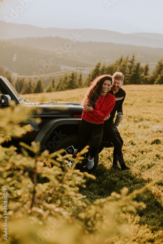 Young couple relaxing by a ...