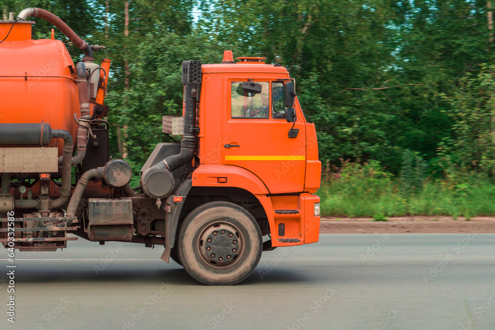 Truck for transporting liquids on road. Motion blur Truck for transporting liquids on road. Motion blur