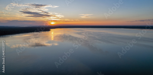 Aerial drone view over sunrise White Lake. Rivne region, Ukraine.