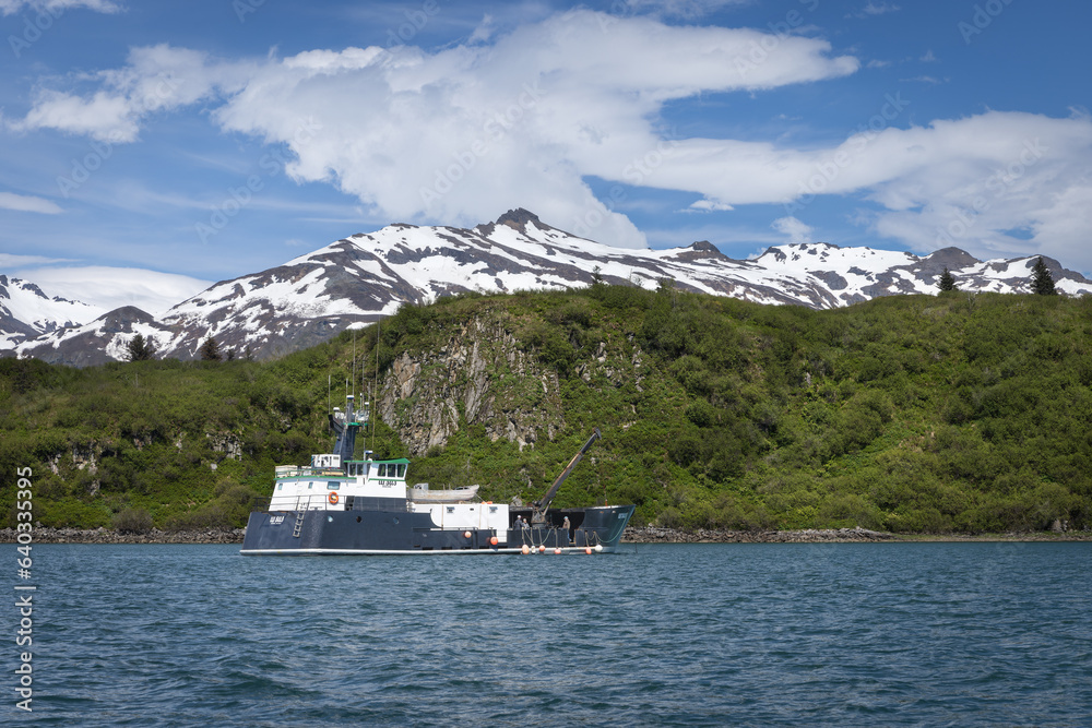 An old clamming boat anchored in Katmai National Park, Alaska with the 