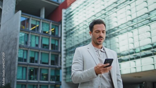 Wallpaper Mural Serious employee calling handsfree device district close up. Businessman talking Torontodigital.ca