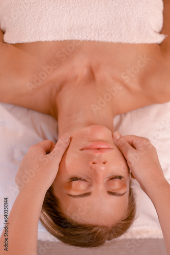 woman relaxing in spa massaging salon. Traditional oriental therapy and massaging treatments. Health and medicine content