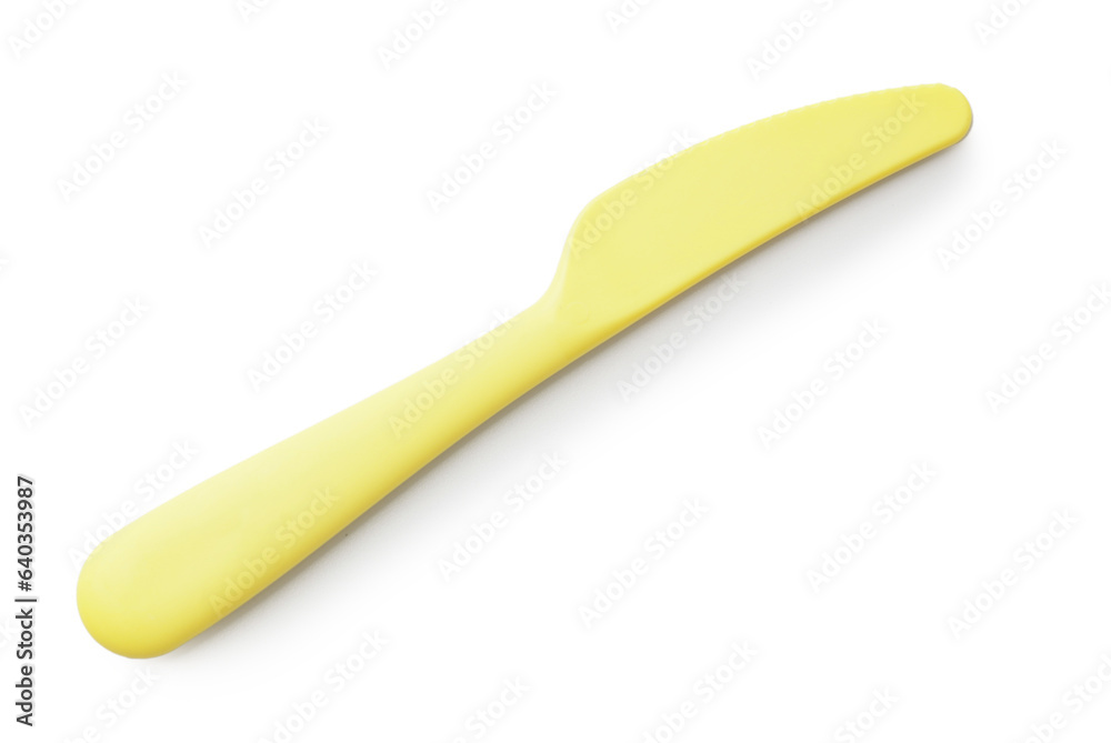 Plastic knife for baby on white background Plastic knife for baby on white background