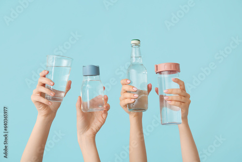 Female hands with bottles a...