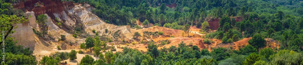 Panoramic view of abstract Rustrel canyon ocher cliffs landscape. Provencal Colorado near Roussillon, Southern France.