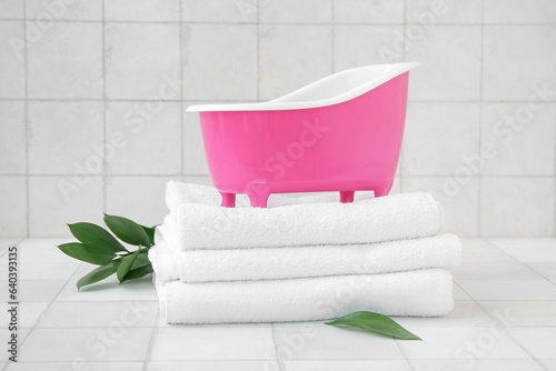 Small bathtub, clean towels...