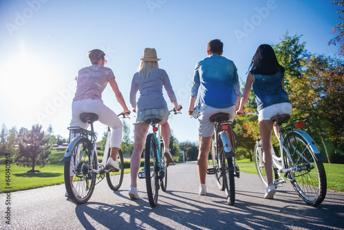 Friends cycling in park