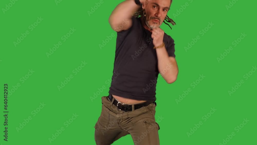 Male Fighter Doing Fight Boxing Practice Training Isolated on Green Screen