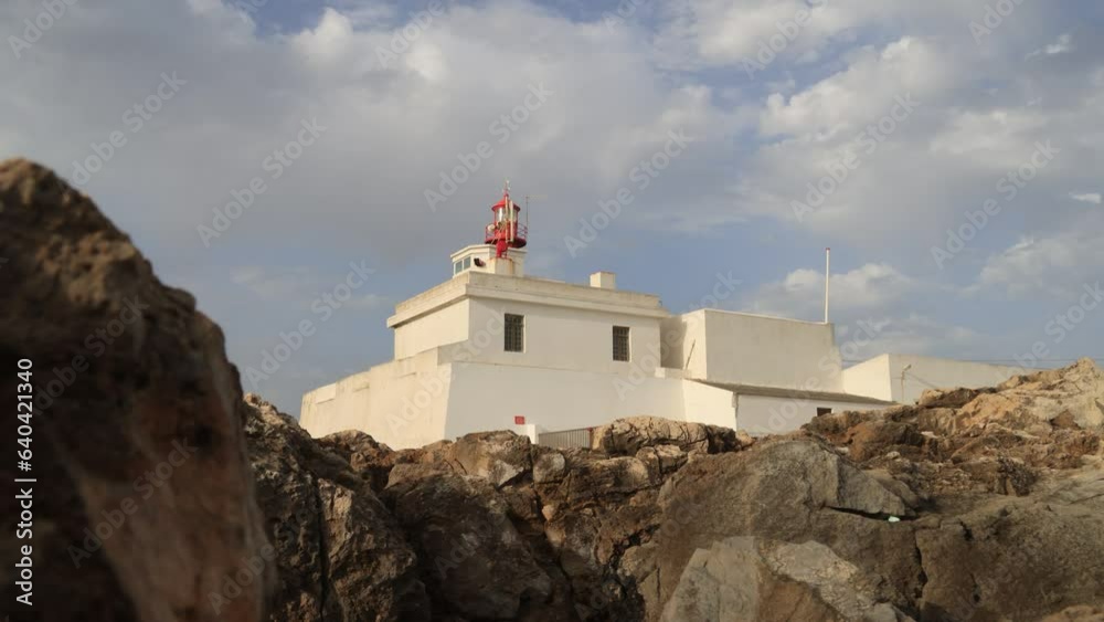 Coastal landscape next to the historic lighthouse of cabo raso in cascais, portugal