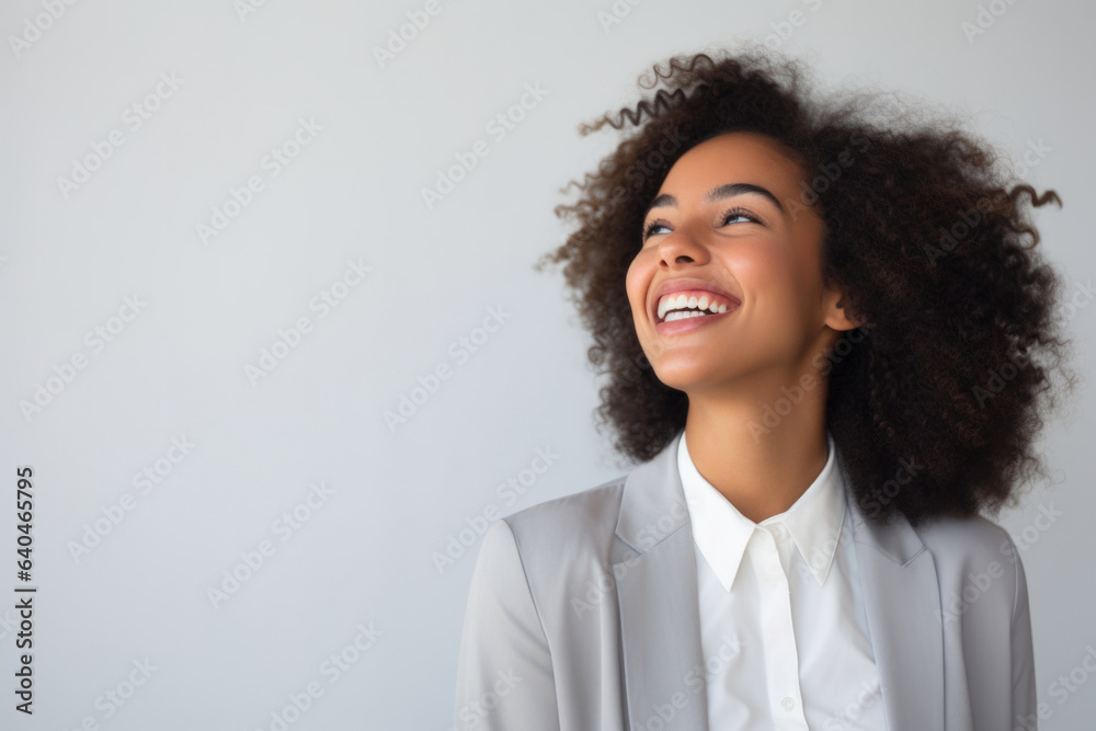 young woman thinking with pensive expression against wall young woman thinking with pensive expression against wall