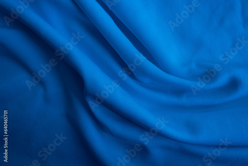 Blue fabric background. Abstract blue wavy cloth.