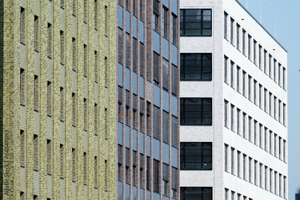 newly built office buildings in green, grey-brown and white in a commercial area in cologne mülheim 2023 newly built office buildings in green, grey-brown and white in a commercial area in cologne mülheim 2023