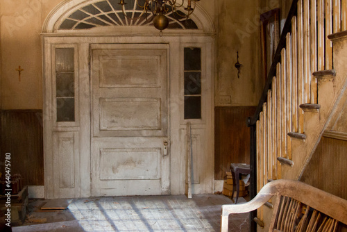 Creepy haunted antique door of plantation.
