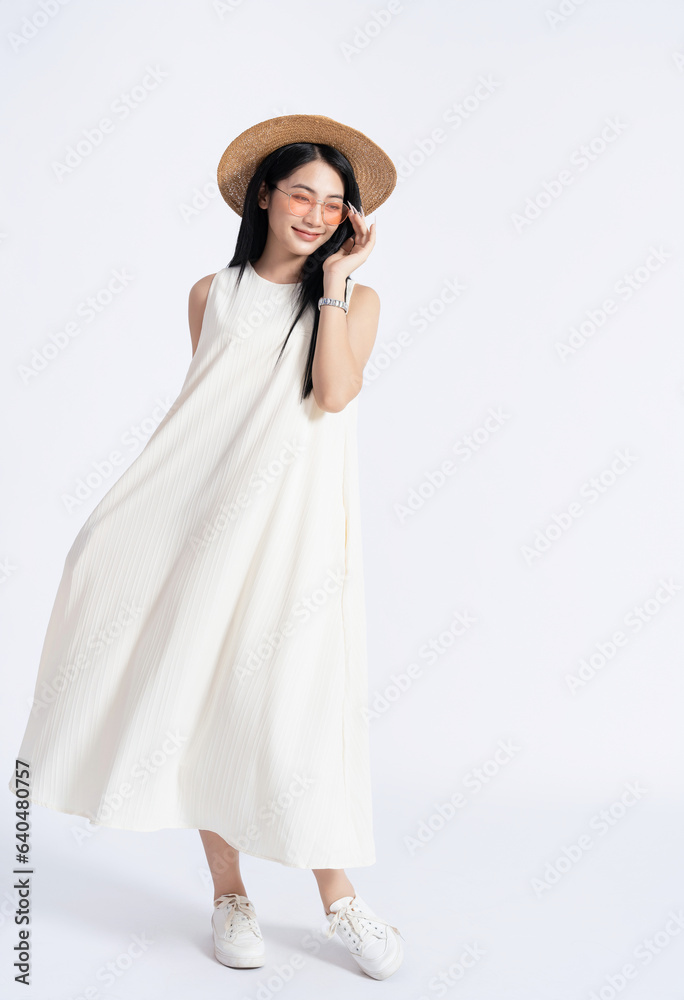 Photo of young Asian girl wearing dress on background
