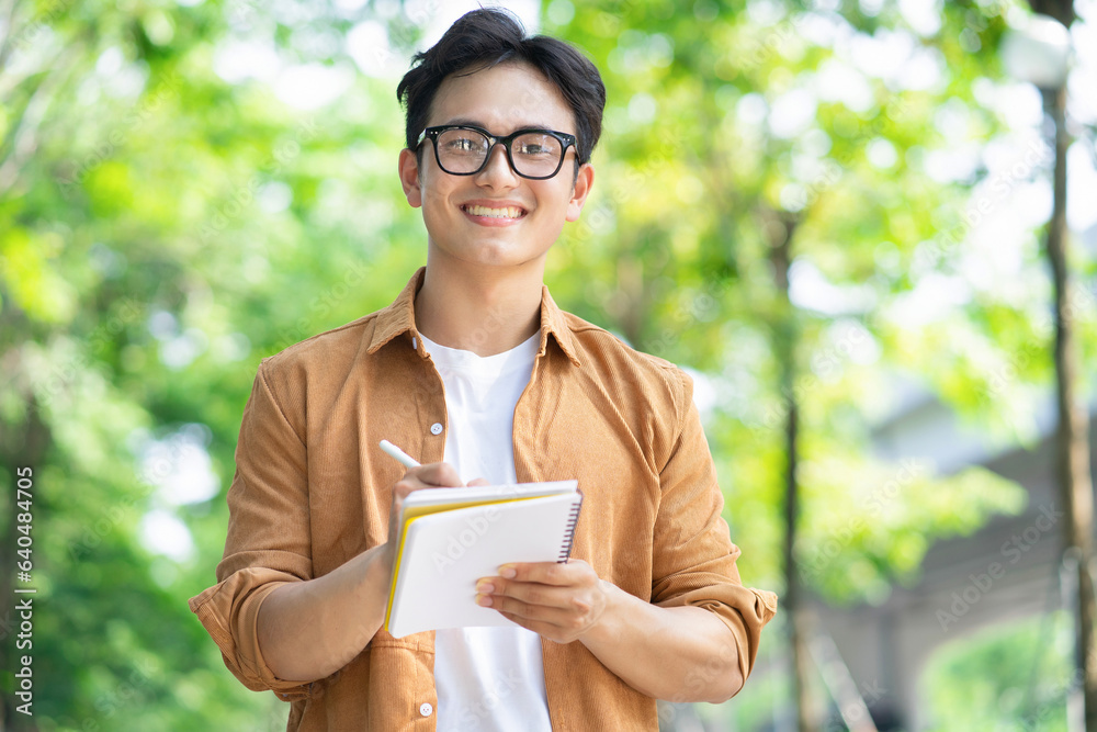 Portrait of young Asian man outside Portrait of young Asian man outside