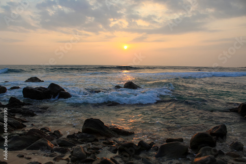 Unawatuna beach in Sri Lanka. Waves crashing on the rocks