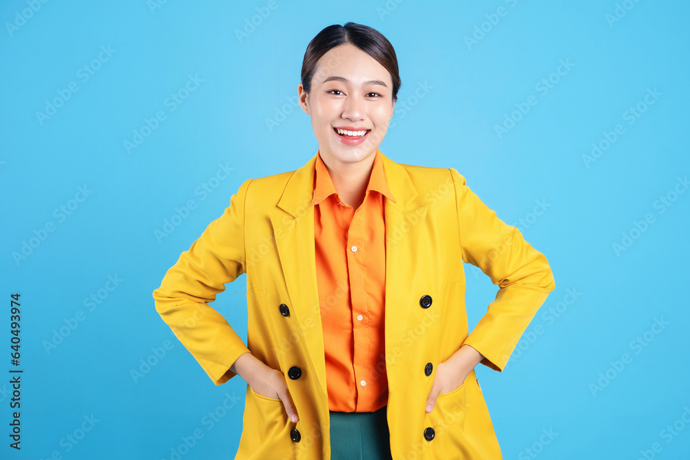 Photo of young Asian businesswoman with colorful suit on background Photo of young Asian businesswoman with colorful suit on background
