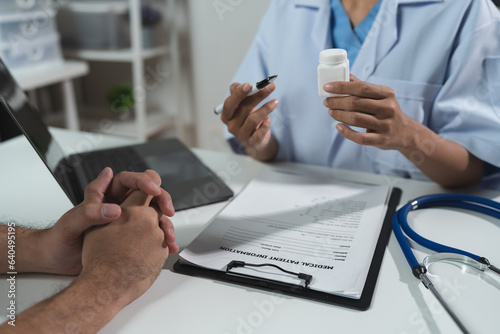 Asian female doctor or medical specialist examining a patient Ask for symptoms, give advice, recommend medication, plan treatment guidelines and preventive care. Concept of health checkup Prevention