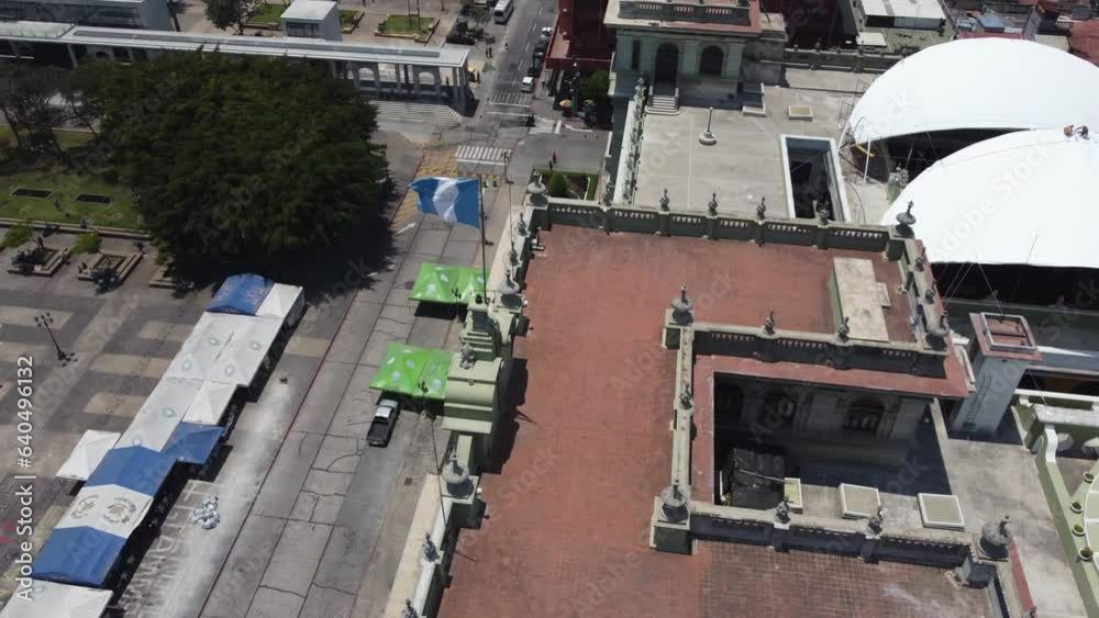 Aerial orbits flag fluttering on National Palace of Culture, Guatemala Aerial orbits flag fluttering on National Palace of Culture, Guatemala