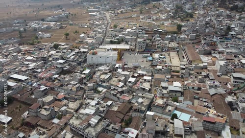 Aerial orbits Mayan Church in center of San Andres Xecul in Guatemala photo