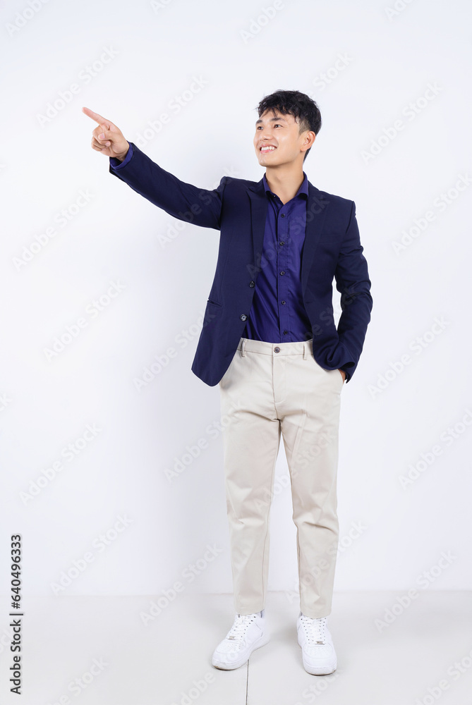 Photo of young Asian businessman on white background Photo of young Asian businessman on white background