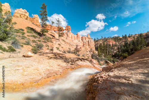 torrent of water moving in a valley surrounded by Hoodoos near Bryce Canyon National Park
