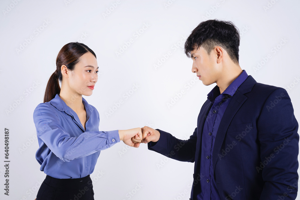 Photo of two young Asian business people on white background Photo of two young Asian business people on white background